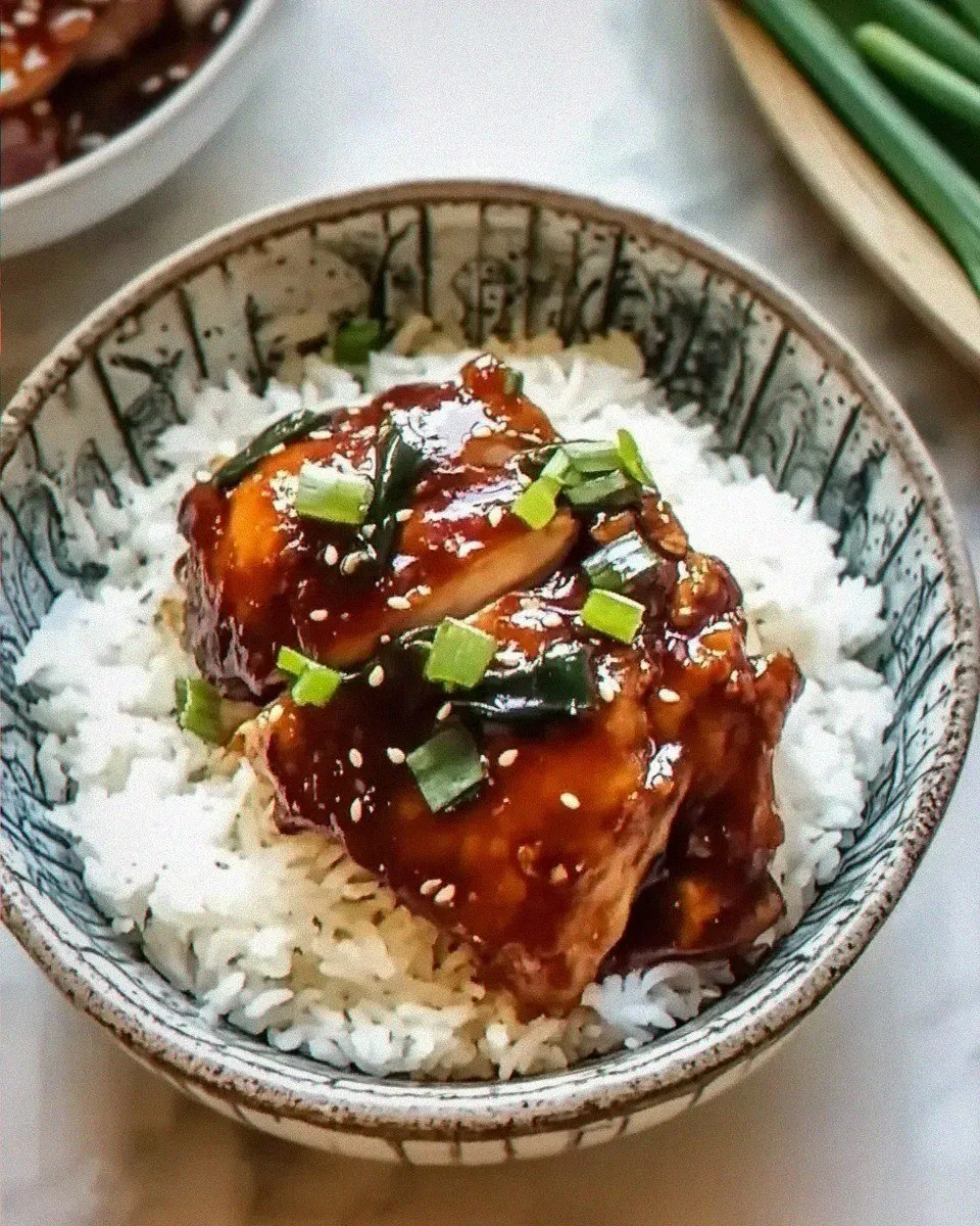 Caramelized Soy Chicken in Garlic Ginger Broth with Rice is pure comfort!