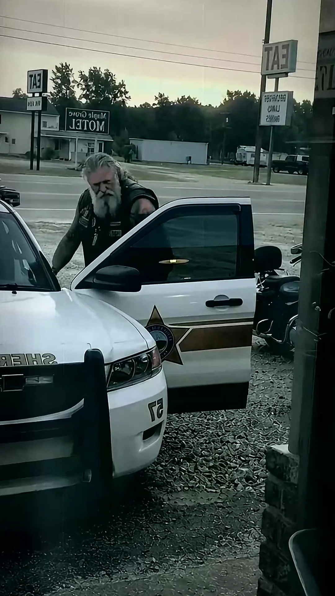 I watched a stranger place a doll in the sheriff’s cruiser and felt my world tilt toward dread